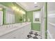Stylish bathroom featuring a double vanity, elegant mirrors, and modern fixtures at 8150 Malibu Pointe Ln, Denver, NC 28037