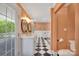 Spacious bathroom with double vanities, soaking tub, and black and white checkered floor at 8150 Malibu Pointe Ln, Denver, NC 28037