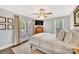 Inviting bedroom with french doors to a deck, neutral bedding, and a ceiling fan at 8150 Malibu Pointe Ln, Denver, NC 28037