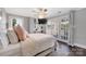 Bright and airy bedroom with patio access, a ceiling fan, and a flat-screen television at 8150 Malibu Pointe Ln, Denver, NC 28037