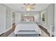 Cozy bedroom with a neutral color palette, a ceiling fan, and a comfortable queen size bed at 8150 Malibu Pointe Ln, Denver, NC 28037