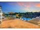 Bask in the serene lake views from the dock featuring a patio, firepit, and charming outdoor seating at 8150 Malibu Pointe Ln, Denver, NC 28037