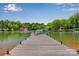 Private dock with clear views of the lake with natural surroundings and lush trees at 8150 Malibu Pointe Ln, Denver, NC 28037