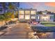 The backyard features a patio, beach, and dock, perfect for waterfront living and entertaining at 8150 Malibu Pointe Ln, Denver, NC 28037