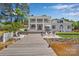 Stunning waterfront property with private dock, and outdoor seating, perfect for entertaining and relaxation at 8150 Malibu Pointe Ln, Denver, NC 28037