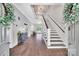 Bright foyer with hardwood floors, chandelier, and staircase leading to the second floor at 8150 Malibu Pointe Ln, Denver, NC 28037