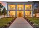 Stately two-story home with a welcoming double-decker front porch and manicured lawn at 8150 Malibu Pointe Ln, Denver, NC 28037