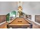 Spacious game room with a pool table, a bar, and ample room for entertaining guests at 8150 Malibu Pointe Ln, Denver, NC 28037