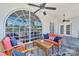 Cozy outdoor patio with comfortable seating overlooking the lake and backyard area at 8150 Malibu Pointe Ln, Denver, NC 28037