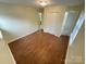 Bedroom with hardwood-style floors, closet, and neutral paint at 837 Corwin Dr, Charlotte, NC 28213