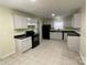 Bright kitchen features neutral cabinets, black appliances, and tile flooring at 837 Corwin Dr, Charlotte, NC 28213