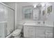 Bathroom featuring a shower, vanity, and window at 8509 Anette Ave, Mint Hill, NC 28227