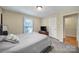 Spacious bedroom features ample natural light, neutral decor, and carpet flooring at 8509 Anette Ave, Mint Hill, NC 28227