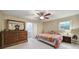 Cozy bedroom with a ceiling fan, natural light, and classic decor at 8509 Anette Ave, Mint Hill, NC 28227