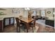 Dining area with wood table, chairs, and overhead lighting, connecting to the living room at 8509 Anette Ave, Mint Hill, NC 28227