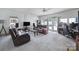 Living room boasting bright lighting, tile floors, multiple sofas, and an entertainment center at 8509 Anette Ave, Mint Hill, NC 28227