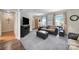 Cozy living room features a large window and comfortable furnishings, perfect for relaxing at 8509 Anette Ave, Mint Hill, NC 28227
