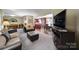 Open concept living room showcases hardwood floors and seamless flow into the dining area at 8509 Anette Ave, Mint Hill, NC 28227