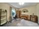 Office area features a desk, piano, and vintage radio, perfect for work or hobbies at 8509 Anette Ave, Mint Hill, NC 28227