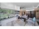 Relaxing screened patio with comfortable seating, ceiling fan, and views of the backyard at 8509 Anette Ave, Mint Hill, NC 28227