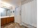 Bathroom features a single sink, built-in cabinets, and shower at 864 Ledgestone Ct, Fort Mill, SC 29708