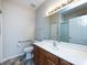 Neutral bathroom with a spacious vanity, large mirror, and accessible features for convenience at 864 Ledgestone Ct, Fort Mill, SC 29708