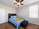 Cozy bedroom with a ceiling fan, hardwood floors, and a large window at 864 Ledgestone Ct, Fort Mill, SC 29708