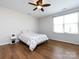 Inviting bedroom features a ceiling fan, a window for natural light, and hardwood floors at 864 Ledgestone Ct, Fort Mill, SC 29708