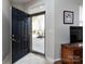 Welcoming entryway with ceramic tiled floor, a black front door with glass features and foyer at 864 Ledgestone Ct, Fort Mill, SC 29708