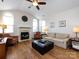 Cozy living room with hardwood floors, vaulted ceiling, fireplace and comfortable seating at 864 Ledgestone Ct, Fort Mill, SC 29708