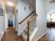 Carpeted staircase with wood railing leading to the upper level at 864 Ledgestone Ct, Fort Mill, SC 29708