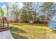 Backyard features a deck with stairs, a fenced yard, and a storage shed at 9624 Buckskin Ln, Mint Hill, NC 28227
