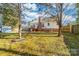 Spacious backyard features a deck, storage shed, and mature trees at 9624 Buckskin Ln, Mint Hill, NC 28227