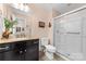Well-lit bathroom features a granite countertop, toilet, and glass shower at 9624 Buckskin Ln, Mint Hill, NC 28227