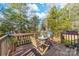 Inviting deck with seating offers views of the private, wooded backyard at 9624 Buckskin Ln, Mint Hill, NC 28227