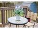 Outdoor deck featuring a decorative table with floral arrangement and comfortable seating, perfect for relaxation at 9624 Buckskin Ln, Mint Hill, NC 28227