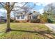 Well maintained home on a grassy lot featuring mature trees, an inviting entrance, and a concrete driveway at 9624 Buckskin Ln, Mint Hill, NC 28227