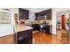 Modern kitchen with stainless steel appliances, granite countertops, and dark cabinetry at 9624 Buckskin Ln, Mint Hill, NC 28227
