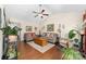 Spacious living room with vaulted ceilings, wood floors, ceiling fan and natural light at 9624 Buckskin Ln, Mint Hill, NC 28227