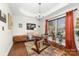Bright office with tray ceiling, hardwood floors, a colorful rug, and lots of natural light at 9624 Buckskin Ln, Mint Hill, NC 28227