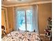 Bright bedroom with a view of the outside patio, complete with a charming bed set at 112 Trestle Cir, New London, NC 28127