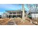 Lake house exterior showcasing a spacious deck and waterfront access for outdoor enjoyment at 112 Trestle Cir, New London, NC 28127