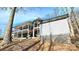 Spacious two-story home with multiple decks, lakeside views, and ample outdoor living space at 112 Trestle Cir, New London, NC 28127