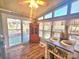 Gathering Room features lots of natural light, hardwood flooring, table, and access to the deck at 112 Trestle Cir, New London, NC 28127