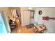 View of laundry area with a stacked washer and dryer and an adjacent dining area at 112 Trestle Cir, New London, NC 28127