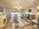 Inviting living room featuring a fireplace, stylish rug, and access to the outdoor space at 112 Trestle Cir, New London, NC 28127