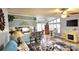 Living room featuring an open floor plan, with ceiling fan, fireplace, and breakfast bar with seating at 112 Trestle Cir, New London, NC 28127