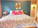 Bedroom featuring colorful decor, large bed, and a hallway that leads to the Primary bathroom at 112 Trestle Cir, New London, NC 28127