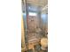 Shower with tile surround, a shower bench, a shower niche, and a glass enclosure at 112 Trestle Cir, New London, NC 28127