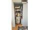 Organized utility closet with a hot water tank and additional storage racks at 112 Trestle Cir, New London, NC 28127